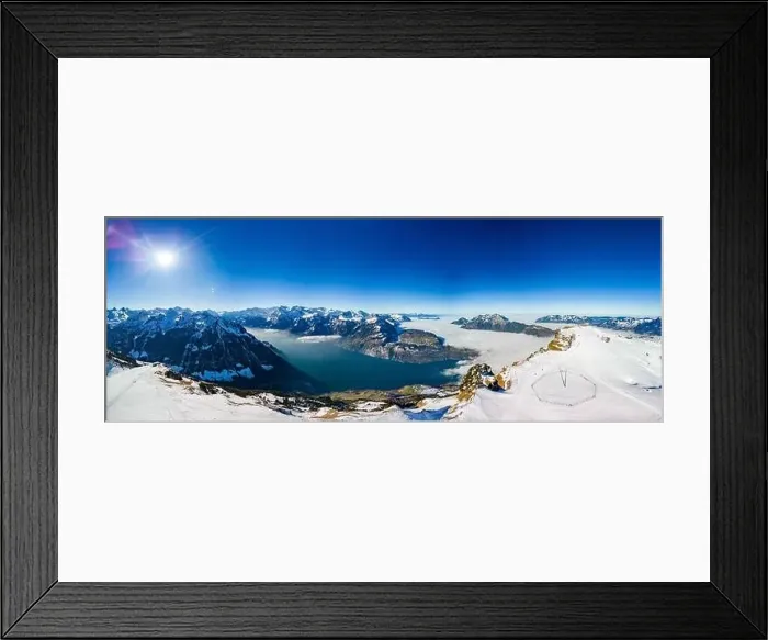 Framed Print : Aerial drone view of snow covered mountains and ski slopes, ski area Stoos, Switzerland Framed Print : Aerial drone view of snow covered mountains and ski slopes, ski area Stoos, Switzerland