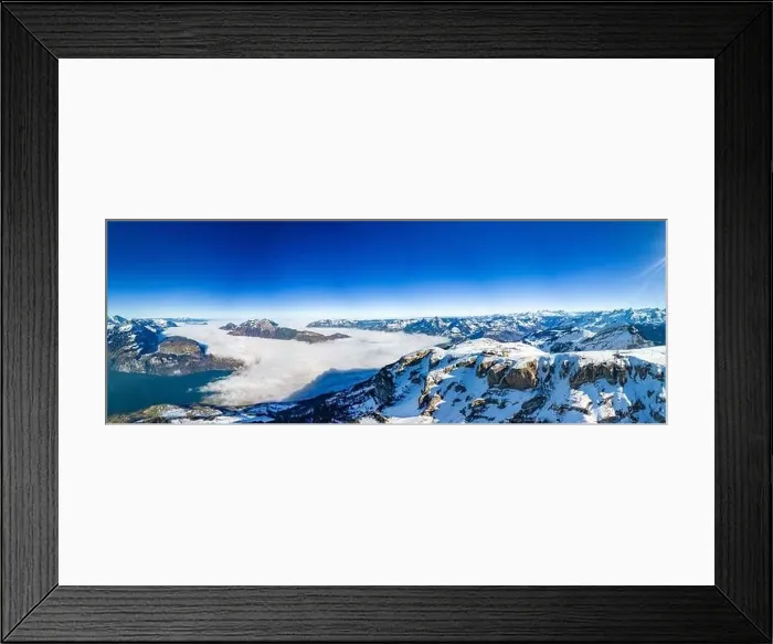 Framed Print : Aerial drone view of snow covered mountains and ski slopes, ski area Stoos, Switzerland Framed Print : Aerial drone view of snow covered mountains and ski slopes, ski area Stoos, Switzerland