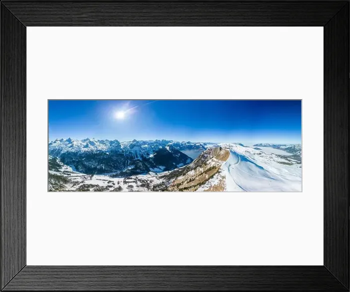 Framed Print : Aerial drone view of snow covered mountains and ski slopes, ski area Stoos, Switzerland Framed Print : Aerial drone view of snow covered mountains and ski slopes, ski area Stoos, Switzerland