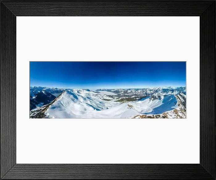 Framed Print : Aerial drone view of snow covered mountains and ski slopes, ski area Stoos, Switzerland Framed Print : Aerial drone view of snow covered mountains and ski slopes, ski area Stoos, Switzerland