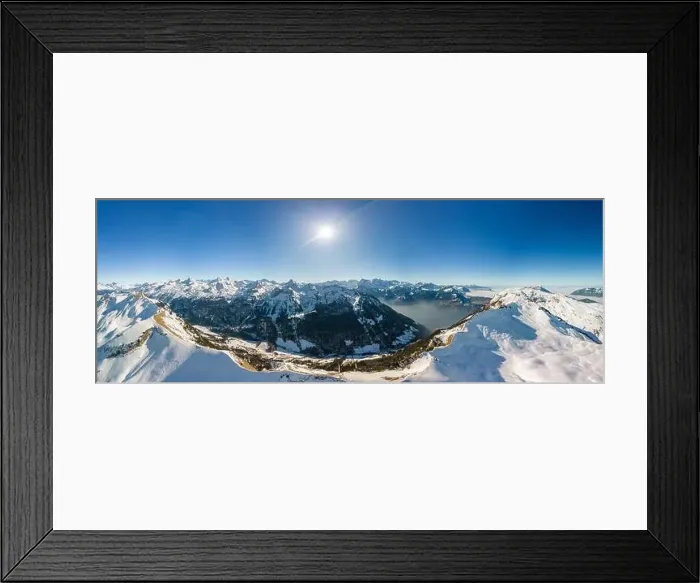 Framed Print : Aerial drone view of snow covered mountains and ski slopes, ski area Stoos, Switzerland