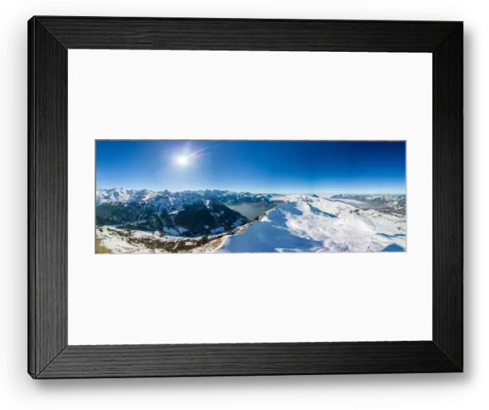 Framed Print : Aerial drone view of snow covered mountains and ski slopes, ski area Stoos, Switzerland Framed Print : Aerial drone view of snow covered mountains and ski slopes, ski area Stoos, Switzerland