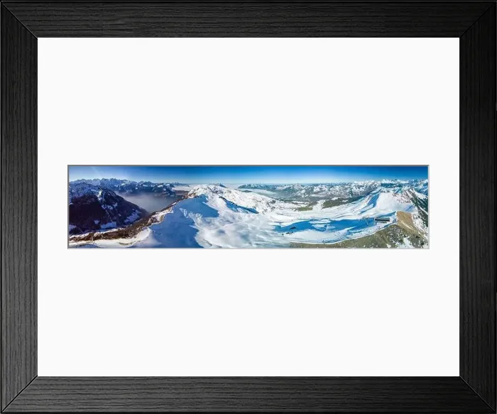 Framed Print : Aerial drone view of snow covered mountains and ski slopes, ski area Stoos, Switzerland Framed Print : Aerial drone view of snow covered mountains and ski slopes, ski area Stoos, Switzerland