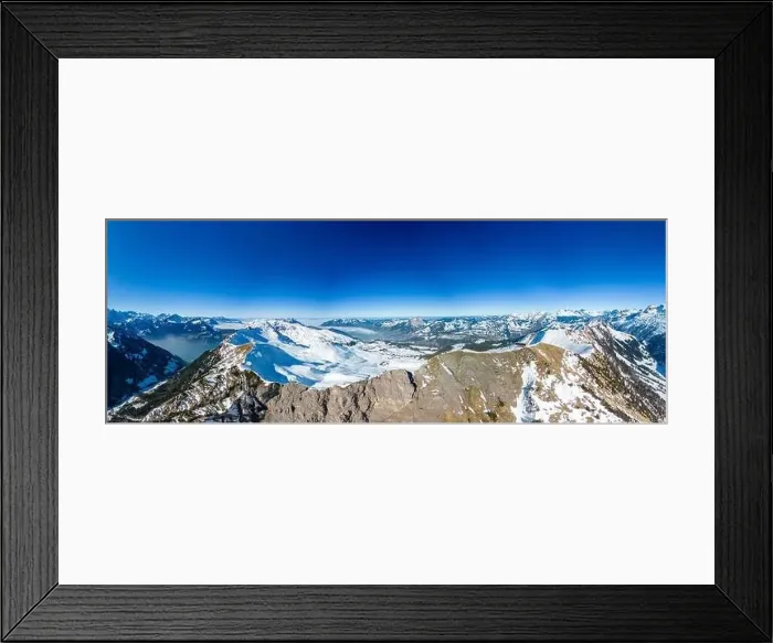 Framed Print : Aerial drone view of snow covered mountains and ski slopes, ski area Stoos, Switzerland Framed Print : Aerial drone view of snow covered mountains and ski slopes, ski area Stoos, Switzerland