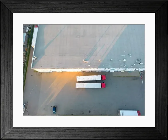 Framed Print : Aerial view of warehouse storages or industrial factory or logistics center from above Framed Print : Aerial view of warehouse storages or industrial factory or logistics center from above