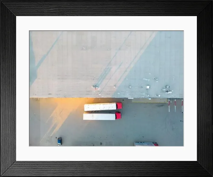 Framed Print : Aerial view of warehouse storages or industrial factory or logistics center from above Framed Print : Aerial view of warehouse storages or industrial factory or logistics center from above