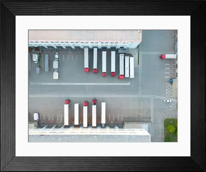 Framed Print : Aerial view of warehouse storages or industrial factory or logistics center from above Framed Print : Aerial view of warehouse storages or industrial factory or logistics center from above