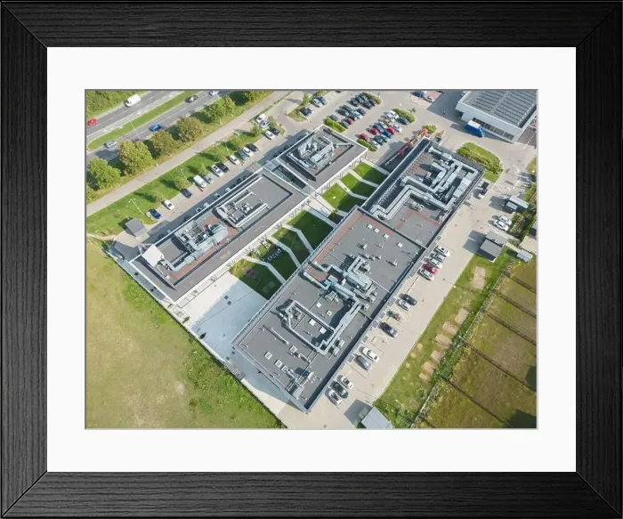 Framed Print : Aerial view of residential houses neighborhood and apartment building complex at sunset Framed Print : Aerial view of residential houses neighborhood and apartment building complex at sunset