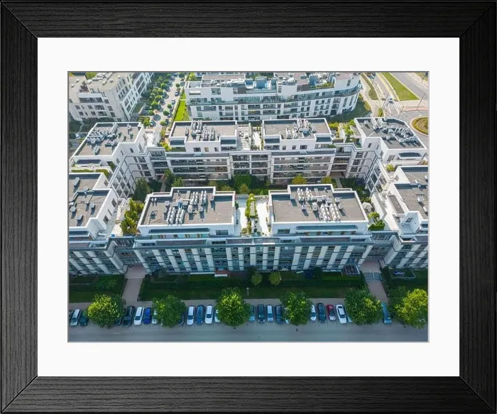 Framed Print : Aerial view of residential houses neighborhood and apartment building complex at sunset Framed Print : Aerial view of residential houses neighborhood and apartment building complex at sunset