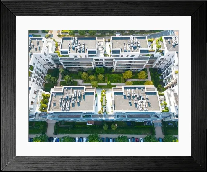 Framed Print : Aerial view of residential houses neighborhood and apartment building complex at sunset Framed Print : Aerial view of residential houses neighborhood and apartment building complex at sunset