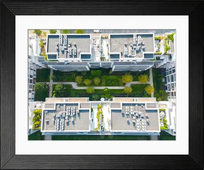 Framed Print : Aerial view of residential houses neighborhood and apartment building complex at sunset Framed Print : Aerial view of residential houses neighborhood and apartment building complex at sunset