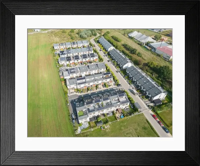Framed Print : Aerial view of residential houses neighborhood and apartment building complex at sunset Framed Print : Aerial view of residential houses neighborhood and apartment building complex at sunset