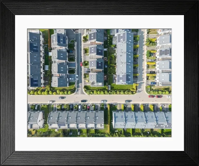 Framed Print : Aerial view of residential houses neighborhood and apartment building complex at sunset Framed Print : Aerial view of residential houses neighborhood and apartment building complex at sunset