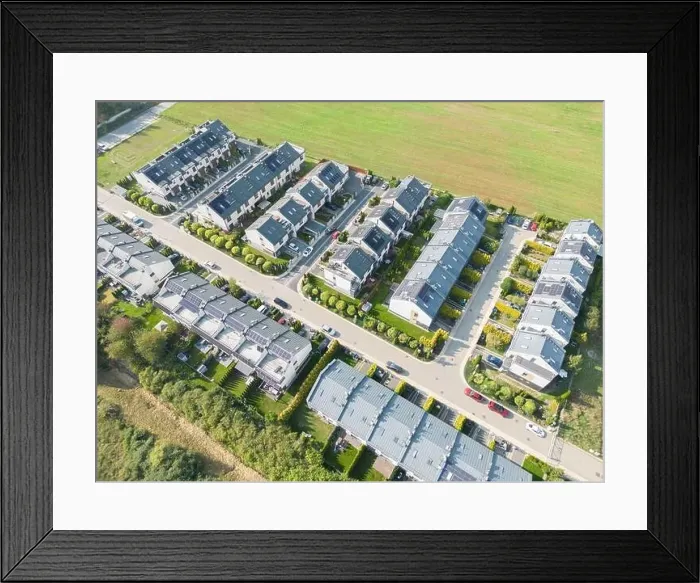 Framed Print : Aerial view of residential houses neighborhood and apartment building complex at sunset Framed Print : Aerial view of residential houses neighborhood and apartment building complex at sunset