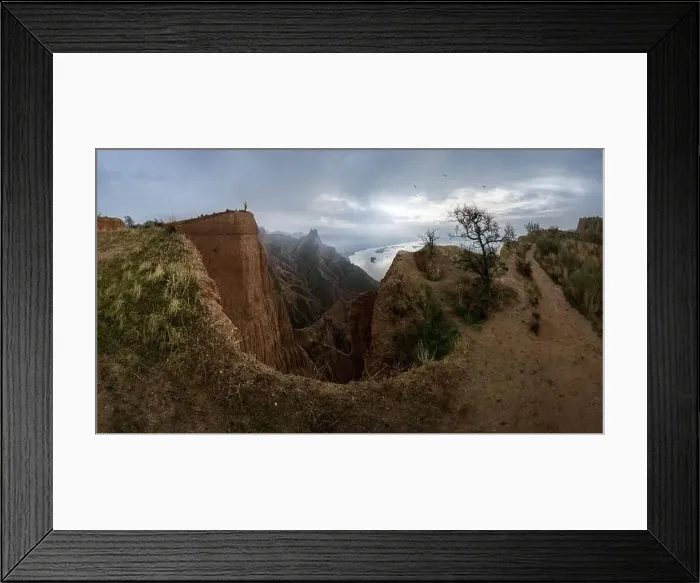 Framed Print : Unrecognizable person standing on mountain cliff admiring peaks valley located near calm rive in Barrancas de Burujon Framed Print : Unrecognizable person standing on mountain cliff admiring peaks valley located near calm rive in Barrancas de Burujon