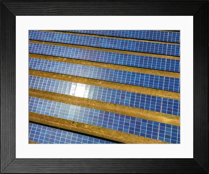 Framed Print : Close up of a solar power plant generating solar electricity over many rows of solar panels on a sunny day, Germany