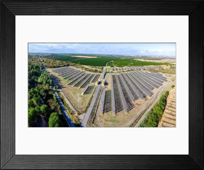Framed Print : Aerial drone view of a farm of solar panels between crop fields Framed Print : Aerial drone view of a farm of solar panels between crop fields