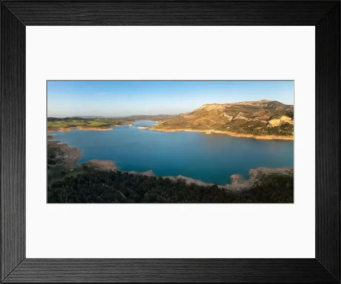 Framed Print : Aerial view of river water flowing from Guadalhorce Dam of Gobantes Spain against rocky mountainous terrain under blue Framed Print : Aerial view of river water flowing from Guadalhorce Dam of Gobantes Spain against rocky mountainous terrain under blue