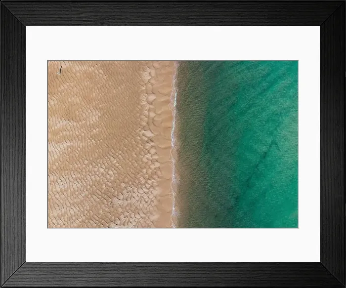 Framed Print : Aerial top view of unrecognizable traveler walking along turquoise ocean washing sandy beach with rippled sand on sunny Framed Print : Aerial top view of unrecognizable traveler walking along turquoise ocean washing sandy beach with rippled sand on sunny