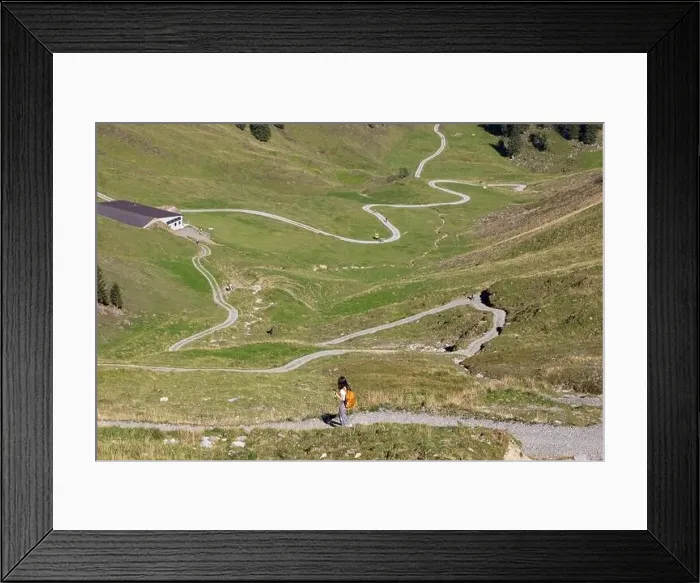 Framed Print : Young woman hiking on a trail in the Alps, Stoos, Schwyz, Switzerland Framed Print : Young woman hiking on a trail in the Alps, Stoos, Schwyz, Switzerland