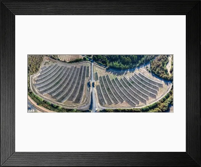 Framed Print : Aerial panoramic drone view of a farm of solar panels between crop fields Framed Print : Aerial panoramic drone view of a farm of solar panels between crop fields