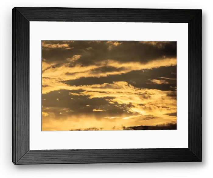 Framed Print : Sunset sky with golden rays of the sun against the background of silhouettes of mountain landscapes and rural villages Framed Print : Sunset sky with golden rays of the sun against the background of silhouettes of mountain landscapes and rural villages