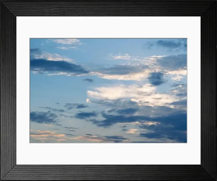 Framed Print : Sunset sky with golden rays of the sun against the background of silhouettes of mountain landscapes and rural villages Framed Print : Sunset sky with golden rays of the sun against the background of silhouettes of mountain landscapes and rural villages