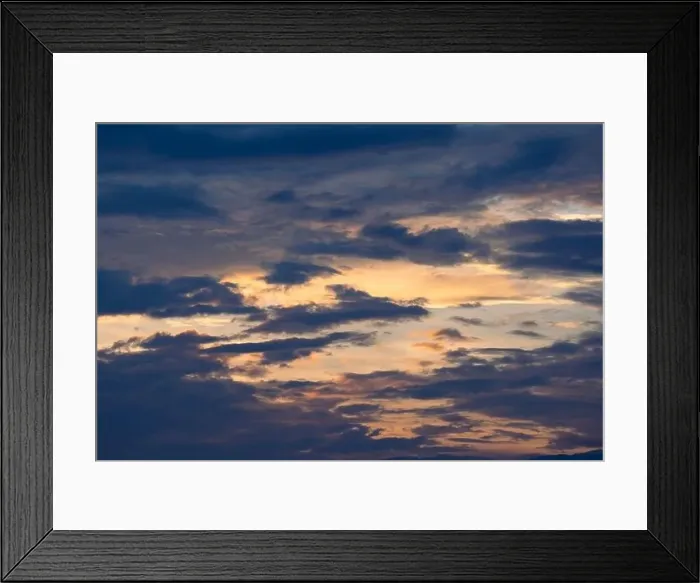 Framed Print : Sunset sky with golden rays of the sun against the background of silhouettes of mountain landscapes and rural villages Framed Print : Sunset sky with golden rays of the sun against the background of silhouettes of mountain landscapes and rural villages