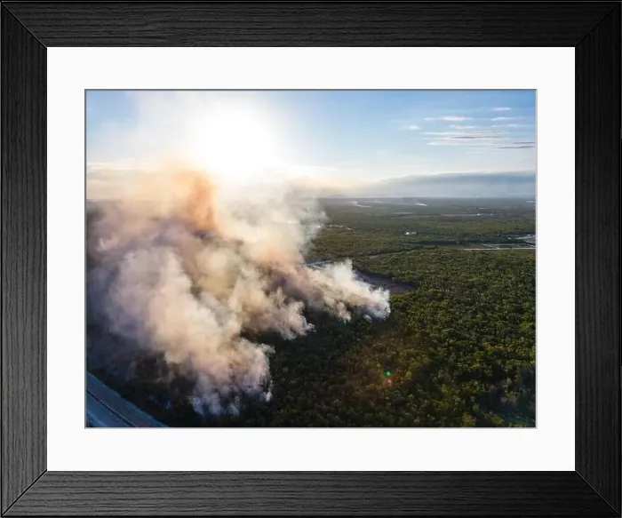 Framed Print : Aerial view the sun shines through the yellow smoke from wildfire in the fields during drought and hot weather Framed Print : Aerial view the sun shines through the yellow smoke from wildfire in the fields during drought and hot weather