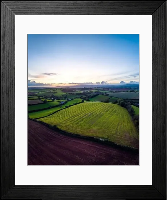 Framed Print : Sunset over Fields and Farms from a drone, Devon, England, Europe Framed Print : Sunset over Fields and Farms from a drone, Devon, England, Europe