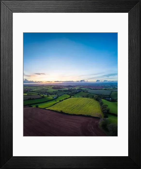 Framed Print : Sunset over Fields and Farms from a drone, Devon, England, Europe Framed Print : Sunset over Fields and Farms from a drone, Devon, England, Europe