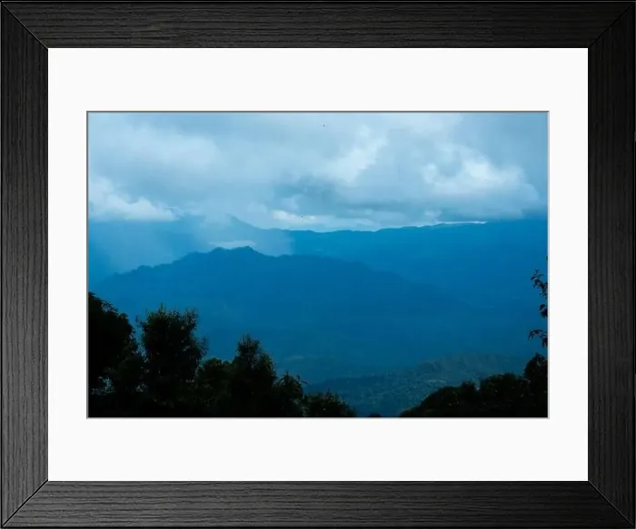 Framed Print : Aerial view over the mountains with sea of fog during morning sunrise in blue sky Framed Print : Aerial view over the mountains with sea of fog during morning sunrise in blue sky