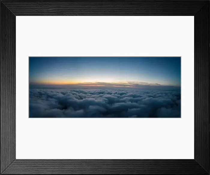 Framed Print : A drone flies over fluffy clouds at sunset. The drone flies through the clouds, creating a sense of wonder and awe Framed Print : A drone flies over fluffy clouds at sunset. The drone flies through the clouds, creating a sense of wonder and awe