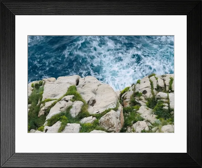 Framed Print : white rocky cliff with wavey blue sea water background Framed Print : white rocky cliff with wavey blue sea water background