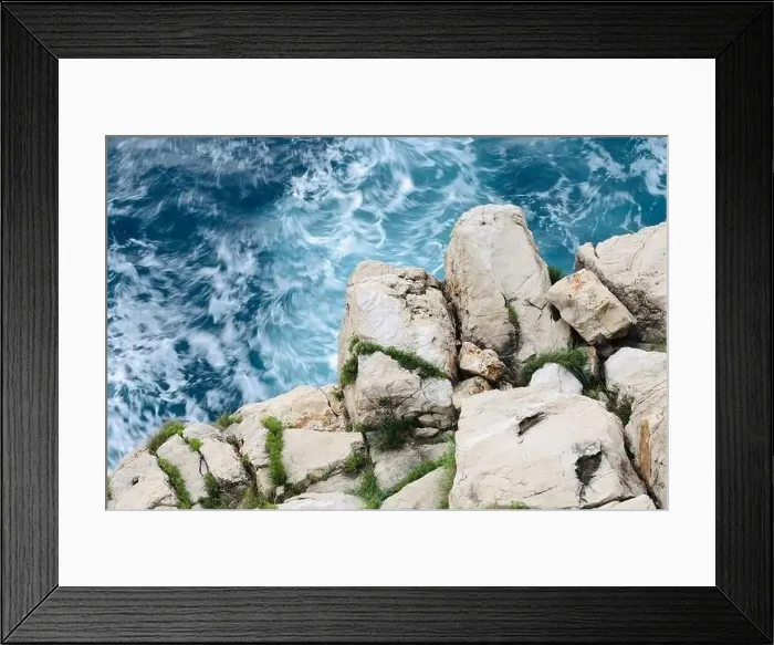 Framed Print : white rocky cliff with wavey blue sea water background Framed Print : white rocky cliff with wavey blue sea water background