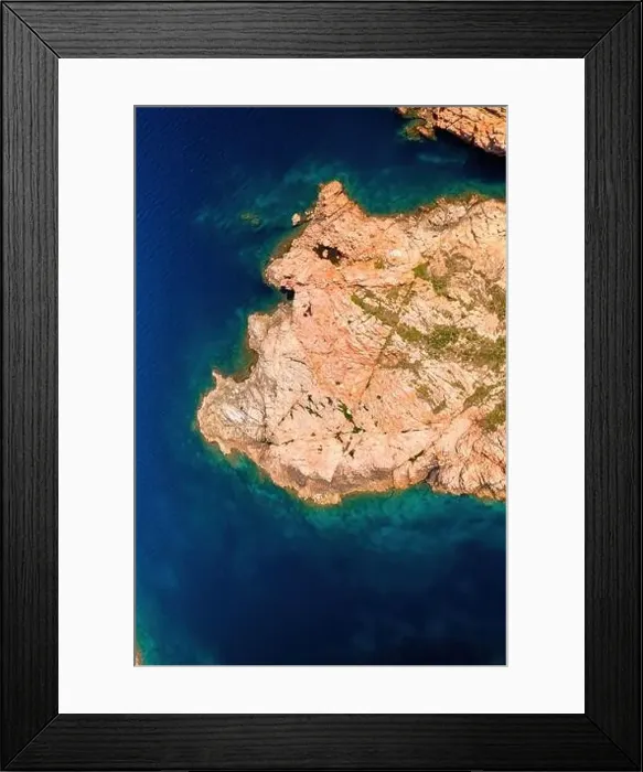 Framed Print : Drone top view of Castelsardo's rugged coastline with serene blue waters in Sardinia, Italy Framed Print : Drone top view of Castelsardo's rugged coastline with serene blue waters in Sardinia, Italy
