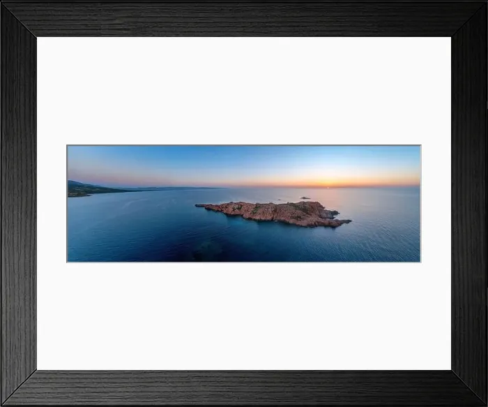 Framed Print : From above drone view of Castelsardo's rugged coastline at sunset with serene waters Framed Print : From above drone view of Castelsardo's rugged coastline at sunset with serene waters