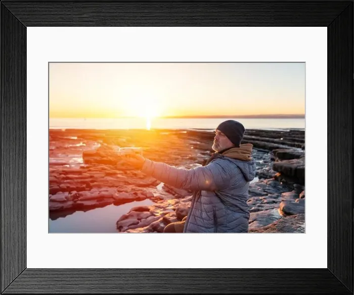 Framed Print : Bearded man using a drone with remote controller making photos and videos, having fun with new technology trends Framed Print : Bearded man using a drone with remote controller making photos and videos, having fun with new technology trends