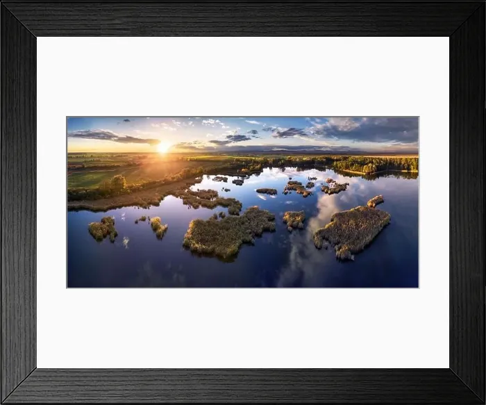 Framed Print : A drone photo of lake - pond bog with sun - Absolutely stunning aerial landscape sunset panorama Framed Print : A drone photo of lake - pond bog with sun - Absolutely stunning aerial landscape sunset panorama