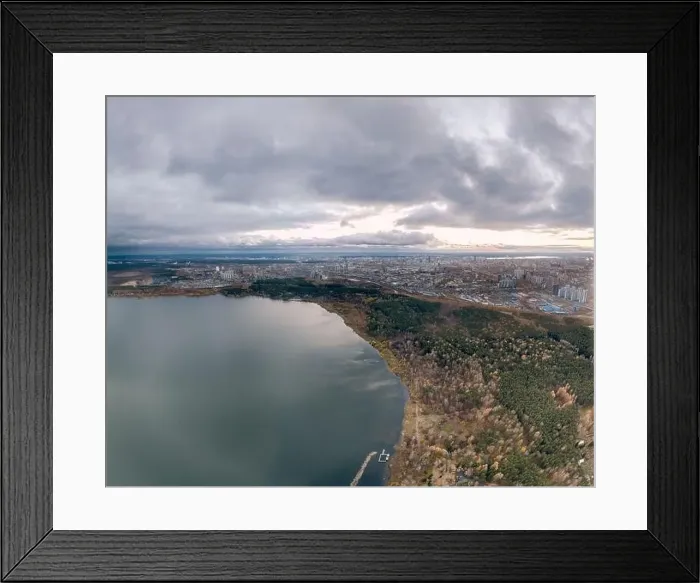 Framed Print : Autumn forest on lake shore at sunset and city on horizon, aerial view. Lake Shartash and Yekaterinburg, Russia Framed Print : Autumn forest on lake shore at sunset and city on horizon, aerial view. Lake Shartash and Yekaterinburg, Russia