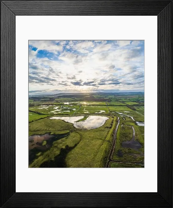 Framed Print : Panorama over Wetlands and Marshes in RSPB Exminster and Powderham Marshe from a drone, Exeter, Devon, England Framed Print : Panorama over Wetlands and Marshes in RSPB Exminster and Powderham Marshe from a drone, Exeter, Devon, England