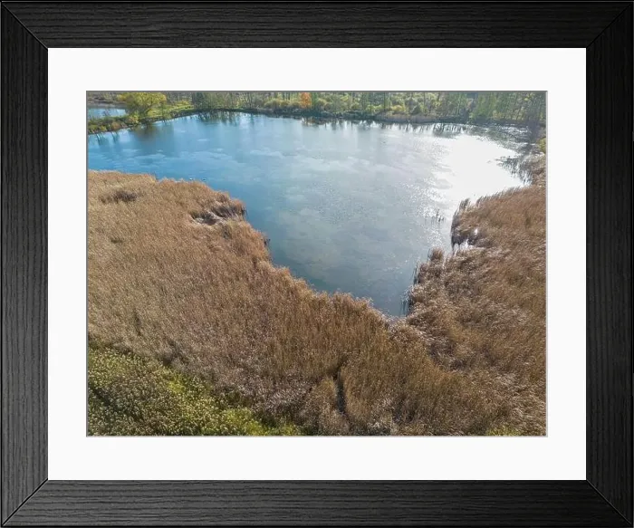 Framed Print : Aerial view of beautiful smooth green waters of a lake on a sunny autumn day Framed Print : Aerial view of beautiful smooth green waters of a lake on a sunny autumn day
