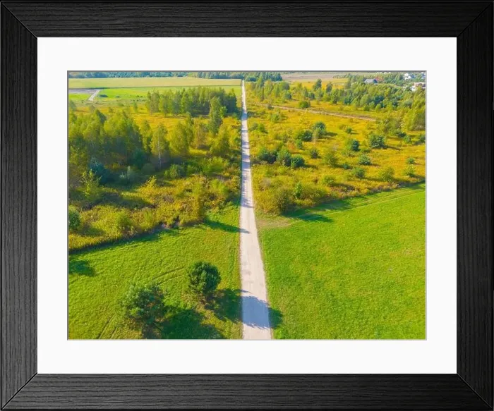 Framed Print : Aerial view of a rural road with in yellow and orange autumn forest Framed Print : Aerial view of a rural road with in yellow and orange autumn forest