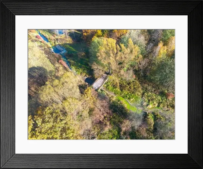 Framed Print : Aerial view of a rural road with in yellow and orange autumn forest Framed Print : Aerial view of a rural road with in yellow and orange autumn forest