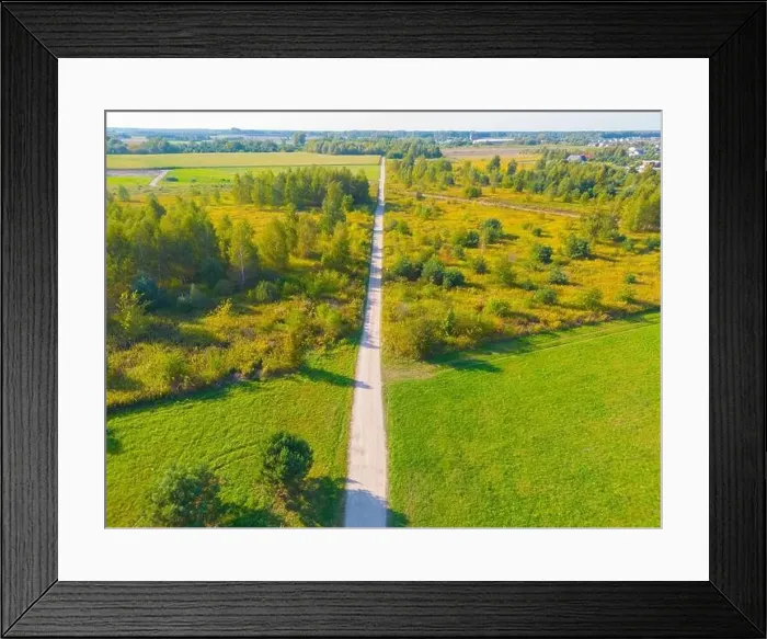 Framed Print : Aerial view of a rural road with in yellow and orange autumn forest Framed Print : Aerial view of a rural road with in yellow and orange autumn forest