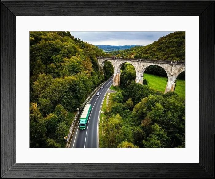 Framed Print : Scenic national road going under an old and disable train viaduct Framed Print : Scenic national road going under an old and disable train viaduct