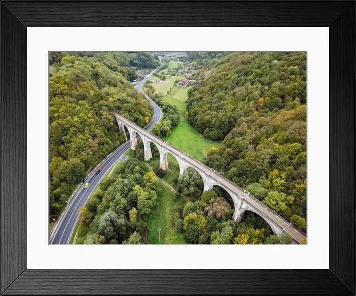 Framed Print : Scenic national road going under an old and disable train viaduct Framed Print : Scenic national road going under an old and disable train viaduct