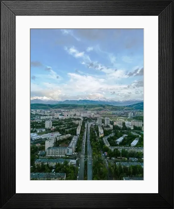 Framed Print : Aerial view of Bishkek city Kyrgyzstan with snowy mountains in the background Framed Print : Aerial view of Bishkek city Kyrgyzstan with snowy mountains in the background
