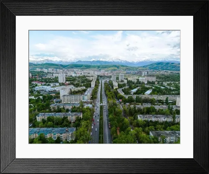 Framed Print : Aerial view of Bishkek city Kyrgyzstan with snowy mountains in the background Framed Print : Aerial view of Bishkek city Kyrgyzstan with snowy mountains in the background