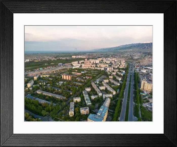 Framed Print : Aerial view of Bishkek city Kyrgyzstan with snowy mountains in the background Framed Print : Aerial view of Bishkek city Kyrgyzstan with snowy mountains in the background
